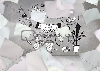 Papers in front of grey wall with graphics