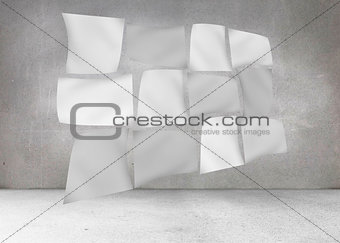 Floating sheets in front of grey wall