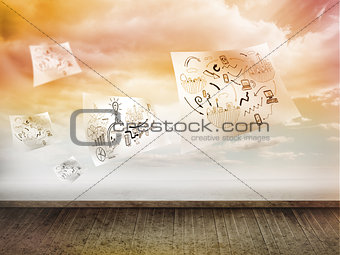 Sheets with graphics over sky on wall