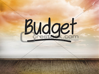 Budget written on wall with sky