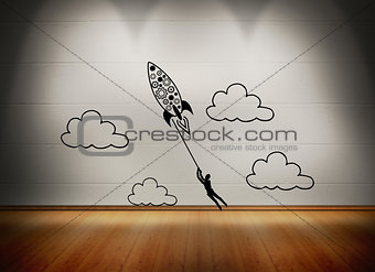 Rocket with man at white wall in room