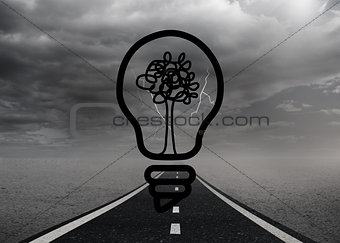 Light bulb with tree over street