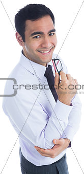 Smiling businessman holding glasses