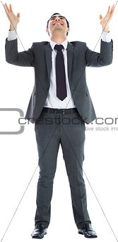 Happy  businessman with arms raised