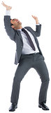 Stressed businessman with arms raised