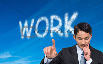 Thoughtful asian businessman pointing