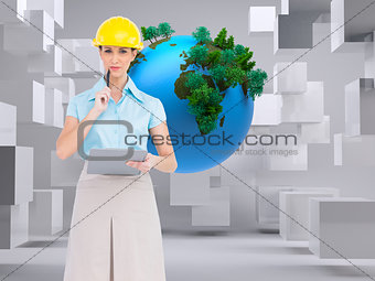 Composite image of attractive architect holding clipboard