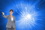 Composite image of businesswoman pointing to something