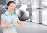 Composite image of peaceful businesswoman praying