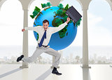 Composite image of jumping businessman with his suitcase