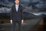 Composite image of serious businessman