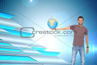 Composite image of man holding out a globe