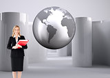 Composite image of businesswoman smiling and holding folders