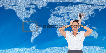 Composite image of worried businesswoman holding newspaper