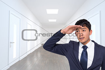 Composite image of casual businessman looking