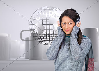 Composite image of model wearing winter clothes listening to music