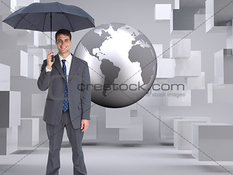 Composite image of businessman holding grey umbrella