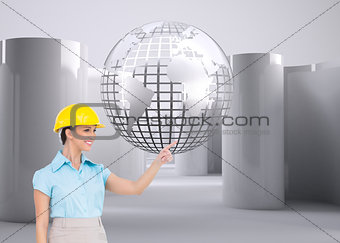 Composite image of attractive architect pointing