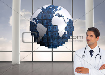 Composite image of doctor with arms crossed looking up