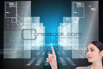 Composite image of saleswoman operating touchscreen