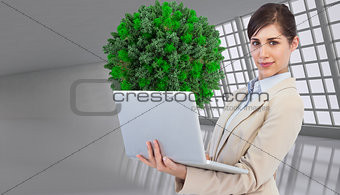 Composite image of young businesswoman with laptop