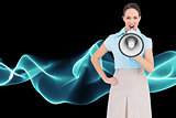 Composite image of furious businesswoman talking in megaphone