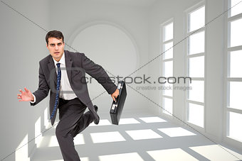 Composite image of businessman in a hury