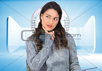 Composite image of model wearing winter clothes holding her tablet