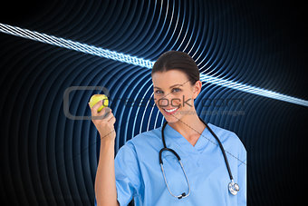 Composite image of surgeon holding an apple and smiling at camera