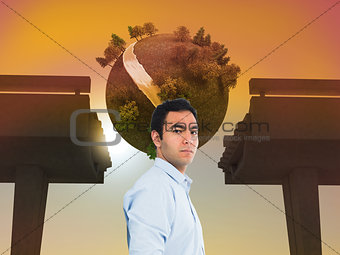 Composite image of unsmiling man standing