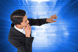 Composite image of  asian businessman pointing