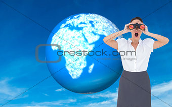 Composite image of shocked businesswoman looking through binoculars