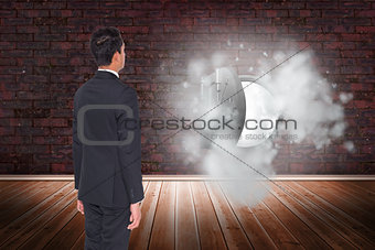 Composite image of businessman turning his back