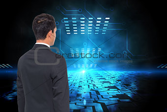 Composite image of businessman against technological blue light