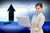 Composite image of businesswoman holding laptop