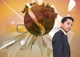 Composite image of businessman against earth floating before abstract background