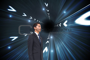 Composite image of businessman looking up