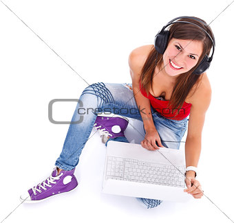 Smiling woman with headphones and laptop