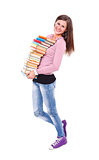 Smiling girl carrying books