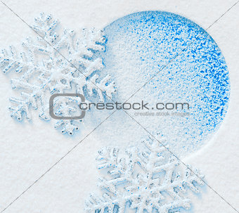 Snowflake on the snow. White xmas holiday background.