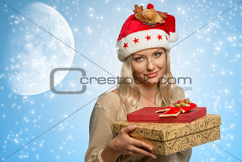 woman with xmas hat and presents 