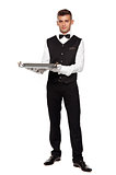 A young boy waiter with a tray