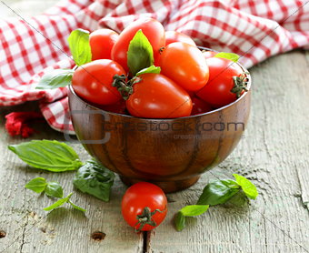 cherry tomatoes with basil leaves