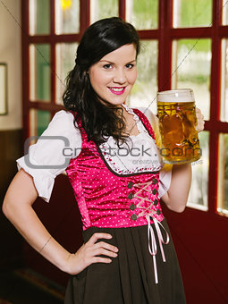 Beautiful woman drinking Oktoberfest beer
