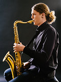 Young man playing the saxophone