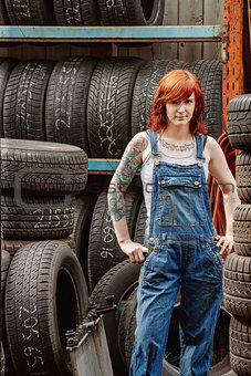 Sexy redhead mechanic with tattoos