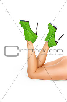 sexy legs in green heels isolated