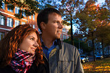 Outdoor happy couple in love posing against autumn Amsterdam bac
