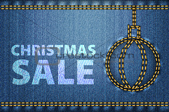 Christmas sale words on blue jeans background