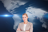 Composite image of confident female executive with folded arms 